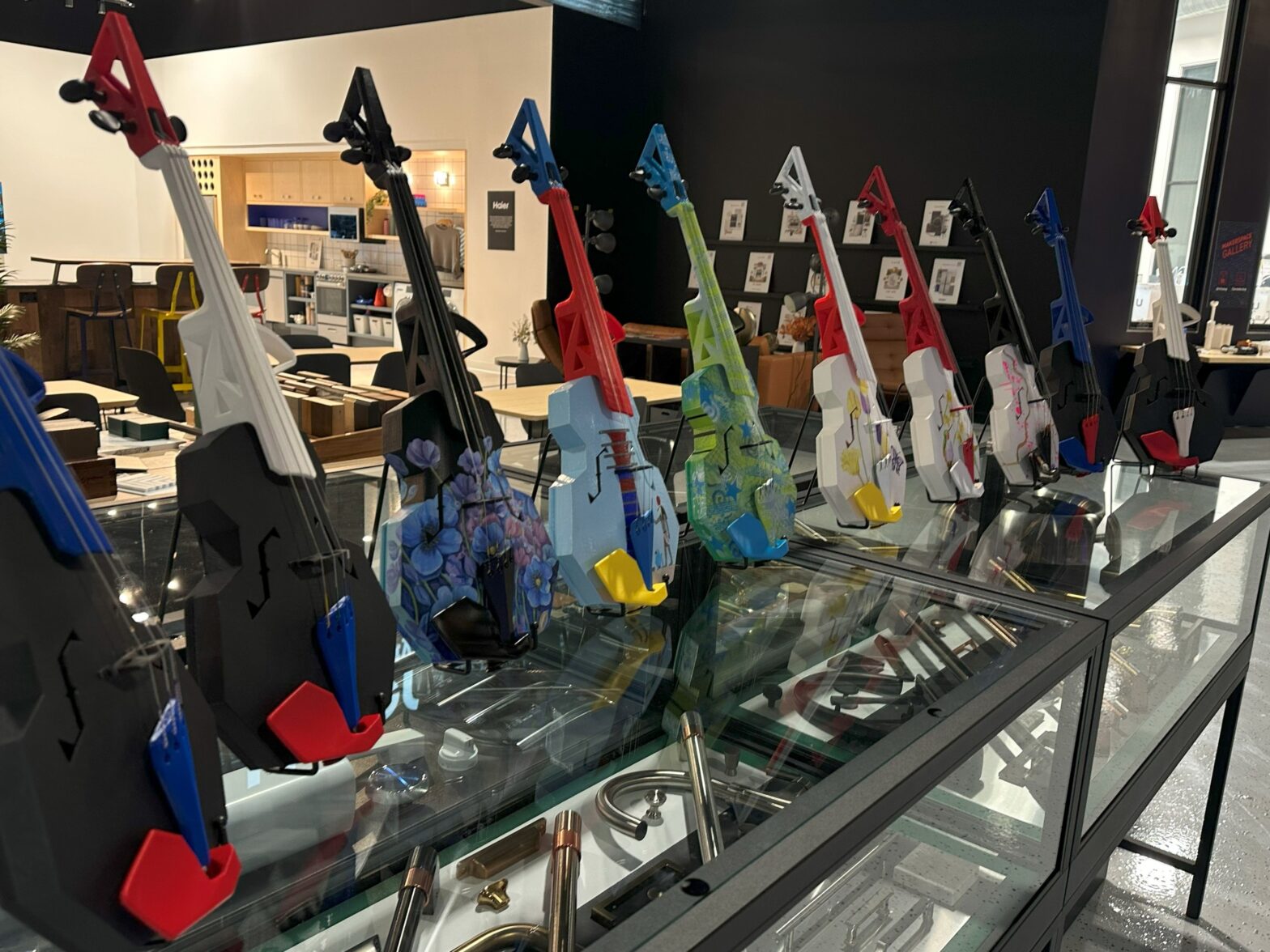 An image of 8 3D printed violins on a glass countertop in CoCreate.