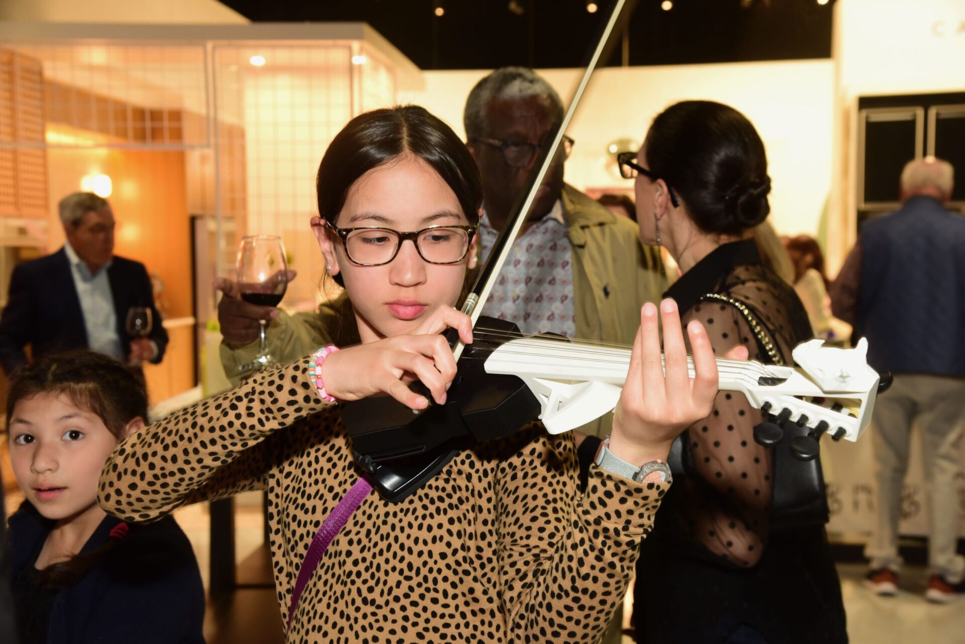 Playing a 3D printed violin at CoCreate during the Project Music Fundraiser