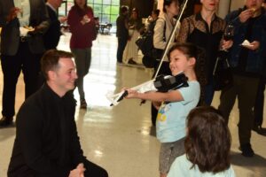 Playing a 3D printed violin at CoCreate during the Project Music Fundraiser